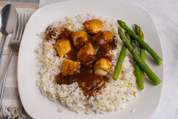 rice with  chicken bites and asparagus