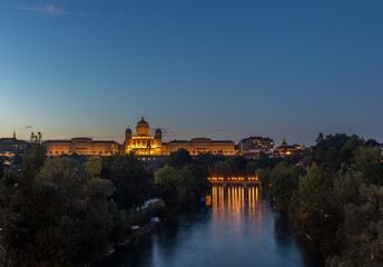 Bern, Switzerland with the Federal Palace illuminated at blue hour.