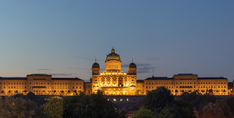 Bern, Switzerland with the Federal Palace illuminated at blue hour.