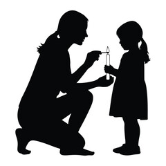 Woman lighting candle for child silhouette