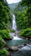 Obraz premium Majestic waterfall cascading through lush green rainforest