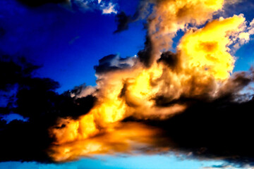 A breathtaking sunset painting the sky with fiery hues and dramatic clouds