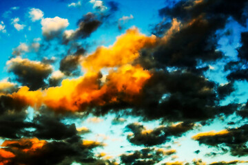 A breathtaking sunset painting the sky with fiery hues and dramatic clouds