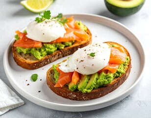 Two avocado toast sandwiches with poached eggs and smoked salmon