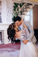 the first dance of the bride and groom inside a restaurant
