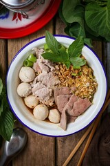 Noodle soup with sliced pork, pig blood, meatball and Thai morning glory,Nam Tok noodles with instant noodles