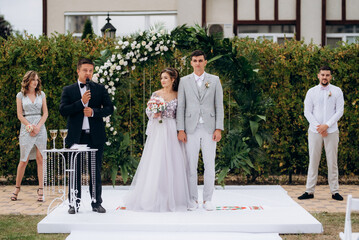 wedding ceremony of the newlyweds on the glade © omelnickiy