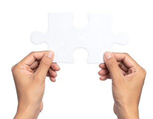 Two hands holding a white jigsaw puzzle piece