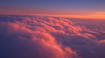 Sunset cloudscape above the clouds Aerial view Dramatic sky colors Pink and purple clouds Beautiful sunset landscape High altitude photography