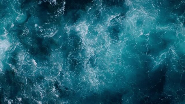 Rough sea surface with continuous whitewater, aerial view. Textured ocean backdrop