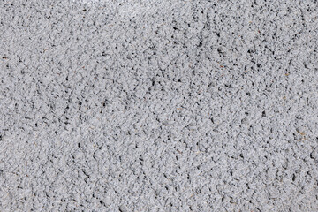 Concrete wall showing rough gray surface. Industrial material offering a detailed abstract texture for construction and design concepts