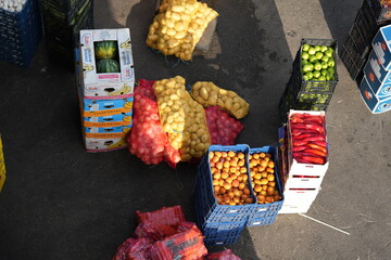 Food delivery to hotel – top view of fresh fruits, vegetables, bottled water and packaged goods...