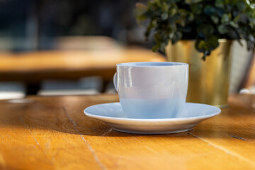 A table in a cafe against the backdrop of a city landscape