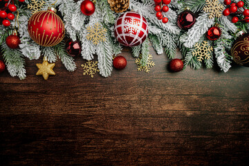 Christmas and New Year background with a festive scene with gold and red Christmas ornaments and...