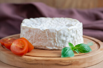 Camambert cheese on cutting board