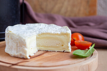 Camambert cheese on cutting board