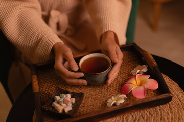 Relaxing tea ceremony after Thai aroma massage with flowers