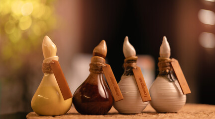 Traditional thai massage aromatherapy with herbal oils and organic scents, warm light