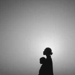Mother and child silhouette Minimalist black and white photography Simple family portrait Backlit profile view