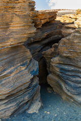 The slope of the Montana Blanca volcano. Narrow, picturesque crevices in volcanic rock.  Las Grietas . Lanzarote, Canary Islands, Spain