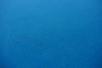 Light blue ceramic tiles in a swimming pool, arranged in a square mosaic pattern. The bright aqua shade enhances the effect of clear water, creating a fresh and tropical atmosphere. Ideal for modern p