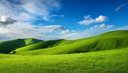 Obraz premium serene green hills rolling to a vibrant blue sky with fluffy clouds majestic grassy