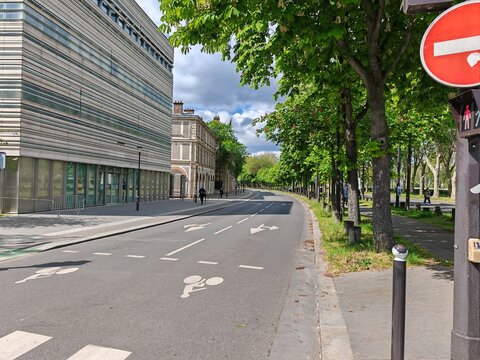 City street with bicycle lane and modern building