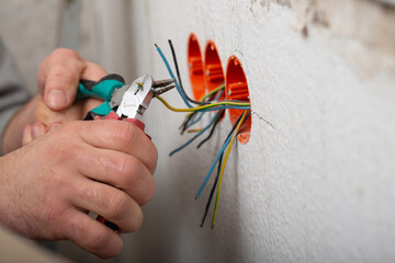 insulation of electricity in sockets, hands in close-up