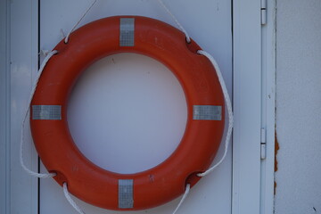 Symbol of safety and reliability. Bright orange lifebuoy on a clean white background &mdash; a perfect metaphor for support, protection, and crisis management. Ideal for insurance, consulting, finance