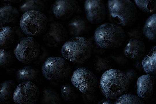 Fresh blueberries close-up. Ripe blue berries with natural texture and soft light. Healthy organic food background for nutrition, cooking, and diet concepts.