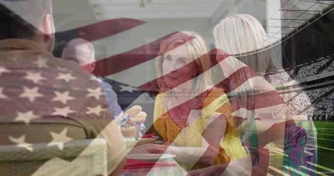 Family group holding serious discussion at patio table, with dishes, wicker basket and flag motif