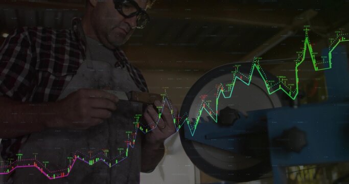 Worker with protective glasses apron filing metal piece in shop grinder, digital charts, copy space - Powered by Adobe