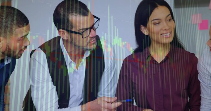 Discussing team wearing business clothes at office desk, with sticky notes, financial chart overlay