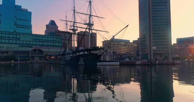 Tall ship at Inner Harbor in Baltimore, Maryland, USA. The ship is a historic landmark, drawing tourists to learn about maritime history and enjoy the waterfront views.