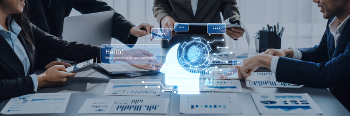 Teams engage in a productive meeting using digital tools and data visuals to drive innovation and strategy in a modern office environment. Trope