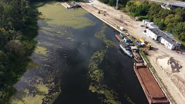 Aerial Bydgoszcz Poland river industrial harbor. Northern Poland. River Brda inland waterway, tributary Vistula. Host international regatta rowing competition. Recreation, fishing, transportation. - Powered by Adobe