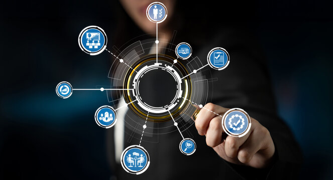 A business professional engages with a digital interface featuring dynamic technology icons and data visualizations, highlighting modern innovation and analytics. Crux