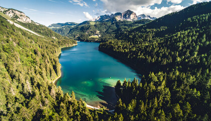 Aerial view of Lago di Tovel, Trentino, Italy, surrounded by mountains and forests.