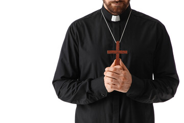 Priest with cross praying on white background, closeup