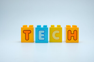 Colorful toy blocks spelling the word TECH on a clean white background. Perfect for illustrating...