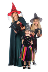 Happy girls with their grandmother dressed as witches for Halloween and word BOO on white background