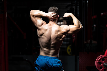 Bodybuilder Flexing Muscles