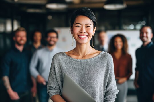 A diverse group of professionals of different ethnicities and backgrounds, working together in a harmonious and inclusive office environment.