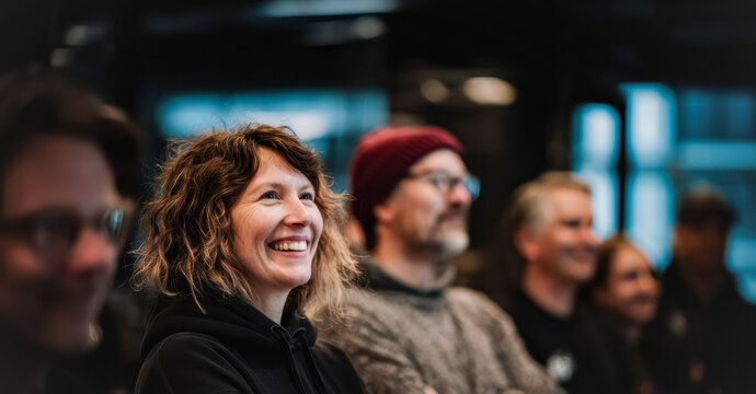 A diverse group of professionals of different ethnicities and backgrounds, working together in a harmonious and inclusive office environment.