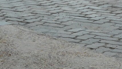 b roll footage of rain hitting the ground on a rainy day capturing natural atmosphere mood and texture perfect for storytelling backgrounds and visual projects