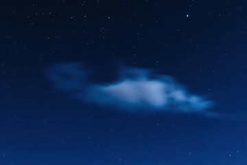 Fototapeta premium Inky Blue Night Sky with Misty Cloud and Sparse Stars - Horizontal Float, Star-Cloud Junction, Soft Exposure, Raw Style, Pure Night Atmosphere