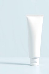 Elegant white cosmetic tube for lotion or cream on a soft blue background showcasing minimalist beauty and modern skincare