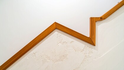 Wooden Staircase Detail Against White Textured Wall