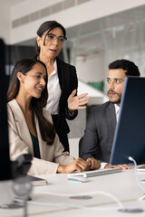 Senior and younger diverse professionals discussing online project