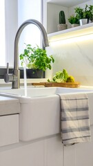 Modern kitchen sink with water running